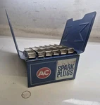 1960S Chevrolet Dealership Fire Ring Spark Plug Manual Rack Display Used. Price: $60.00.