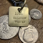 1981 De Lorean DMC-12 Brass Key Fob New. Price: $16.95.